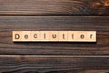 Declutter word written on wood block. Declutter text on wooden table for your desing, concept Royalty Free Stock Photo