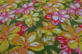 Deco fabric from the 70s with colorful, stylized floral pattern. Detail photo.
