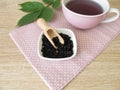 Decoction, boiled tea from dried elder berries Royalty Free Stock Photo