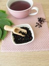 Decoction, boiled tea from dried elder berries Royalty Free Stock Photo
