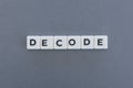 Decode word made of square letter word on grey background Royalty Free Stock Photo