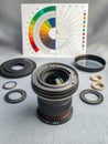 Deconstructed camera lens with internal elements arranged in technical diagram layout Royalty Free Stock Photo