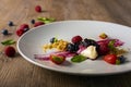 Deconstructed cheescake with mixed berries, selective focus Royalty Free Stock Photo