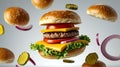 Deconstructed cheeseburger with floating fresh ingredients against a clean background Royalty Free Stock Photo