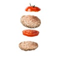 A deconstructed sandwich with crispy bread and tomato slices are floating on a white isolated background. Flying Ingredients