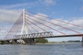 Deconstruction of an old bridge next to a new suspension bridge