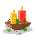 Decor of candles for Christmas and the new year in a stand with leaves and berries of holly. With stars and brilliance