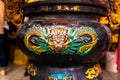 Decor in a Chinese temple. Traditional Chinese dragon on a metal vat