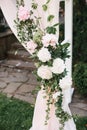 Decor, decoration with fresh flowers of wedding arch. Festive decor for a wedding or birthday. Royalty Free Stock Photo