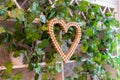 Decor in the form of a heart made of corks placed on the wall Royalty Free Stock Photo