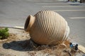 A large clay pot or amphora lies as decoration in the garden. Lardos, Rhodes Island, South Aegean region, Greece Royalty Free Stock Photo