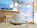 Decor with sea sand, seashells and coffee cup