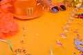 Decor for a traditional celebration of King's Day in the Netherlands. Orange hat, glasses,