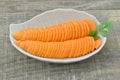 Decorate fresh carrot and slices on wooden table
