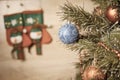 Decorated ball on Christmas tree with wooden background Royalty Free Stock Photo