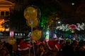 Decorated balloons, lights and Christmas celebration at illuminated Park street with joy and year end festive mood. Dark sky