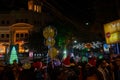 Decorated balloons, lights and Christmas celebration at illuminated Park street with joy and year end festive mood. Dark sky