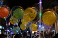 Decorated balloons, lights and Christmas celebration at illuminated Park street with joy and year end festive mood. Dark sky