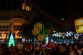 Decorated balloons, lights and Christmas celebration at illuminated Park street with joy and year end festive mood. Dark sky