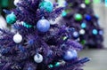 Decorated blue christmas tree with reflection of sparkling second christmas tree. Bright blue Christmas wallpaper with two elegant Royalty Free Stock Photo