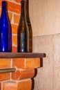 Decorated bottles of colored glass on the stove shelf Royalty Free Stock Photo