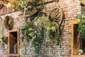 Decorated brick wall with farmer tools and wheat and leaves Royalty Free Stock Photo