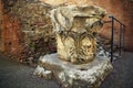 Decorated capital in the Colosseum - landmark attraction in Rome, Italy