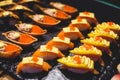 Decorated catering banquet table with different asian sushi rolls and nigiri sushi plate assortment on a party Royalty Free Stock Photo