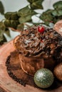 Decorated chocolate Christmas cupcake, cookies, and colorful decorations