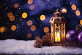 Decorated Christmas, burning candles, lantern on snow and fir tree branch on magic bokeh lights background, gold and dark violet Royalty Free Stock Photo