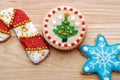 Decorated Christmas Cut Out Cookies on Natural Wood Grain