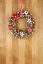 Decorated Christmas Door Wreath Red White Cloth Stars on Sapele Royalty Free Stock Photo