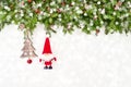 Decorated Christmas fir tree branch with Santa on white wooden background. Copy space Royalty Free Stock Photo