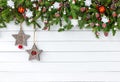 Decorated Christmas fir tree branch with on white wooden board background. Top view, copy space Royalty Free Stock Photo