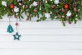 Decorated Christmas fir tree branch with on white wooden board background. Top view, copy space Royalty Free Stock Photo