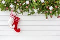 Decorated Christmas fir tree, Christmas socks on white wooden board background. Top view, copy space Royalty Free Stock Photo