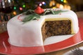 Decorated Christmas Fruit Cake with slices taken Royalty Free Stock Photo