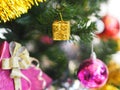 Decorated Christmas green tree decorations have Gift box gold red ball hanging pine, leaves on blurred of background Royalty Free Stock Photo