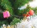 Decorated Christmas green tree decorations have Gift box gold red ball hanging pine, leaves on blurred of background Royalty Free Stock Photo