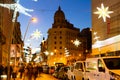 Decorated with Christmas lights Barcelona street on winter twilight Royalty Free Stock Photo