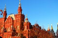 Historical Museum on red square in Moscow under a blue sky with trees decorated with red balloons Royalty Free Stock Photo