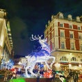 Decorated Christmas stag outside London`s Covent Garden.