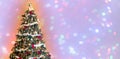 Decorated christmas tree against wide background