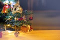 Decorated Christmas tree on blurred sparkling and little gift box background Royalty Free Stock Photo