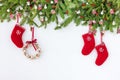 Decorated Christmas tree, Christmas wreath and red socks on white wooden background. Copy space, top view Royalty Free Stock Photo