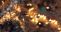 Decorated Christmas tree closeup blurred background with copy space. illuminated garland with flashlights. New Year baubles macro Royalty Free Stock Photo