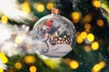 Decorated christmas tree closeup. Snowman ball and illuminated gold garland. New Year atmosphere. Winter holiday background Royalty Free Stock Photo