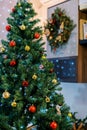 Decorated Christmas tree with colorful balls, toys and sparkling garlands Royalty Free Stock Photo