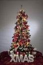 Decorated christmas tree with electric candles and presents Royalty Free Stock Photo