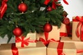 Decorated Christmas tree and gift boxes on light background, closeup Royalty Free Stock Photo